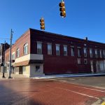 100 S. Superior Street, shown with burned-out upper windows