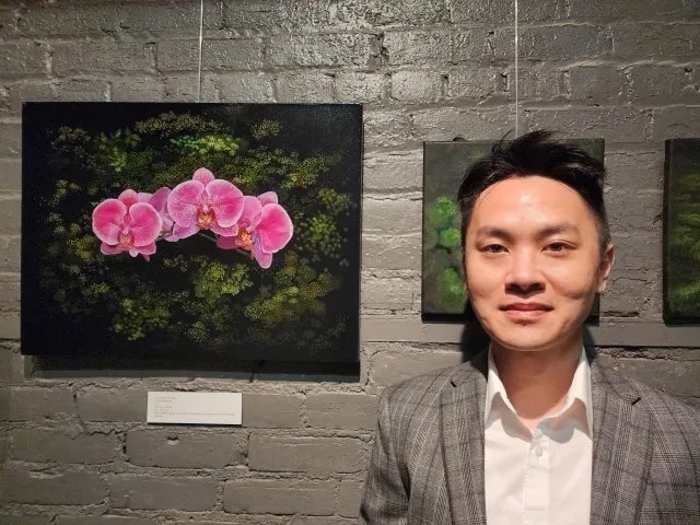 Local resident Yujung Shen has many styles of art and media. The orchid paintings he has on display that the Albion Art Center features a small stroke method he uses to help create the unique view of the orchid.